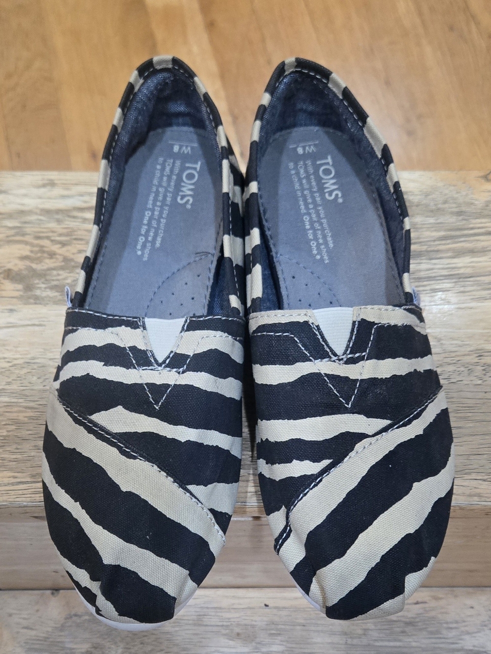 TOMS Women's Zebra-Print Slip-On Flats in Black and Cream
